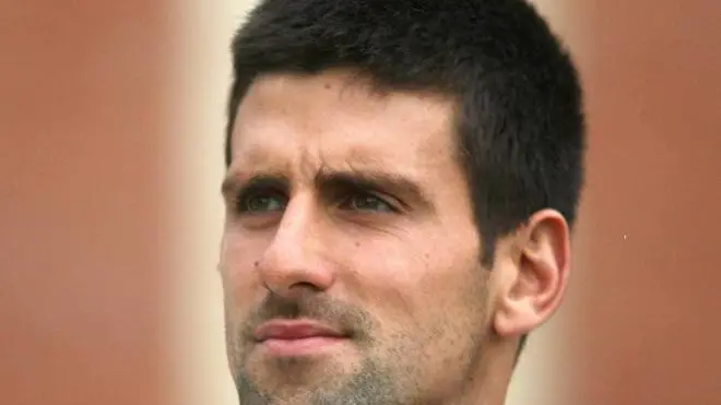 21.06.2012 Stoke Park, Buckinghamshire, England. The Boodles Tennis 2012. Novak Djokovic (SRB) looks on moments before the rain comes down and his match with Andy Murray (GBR) is called-off.