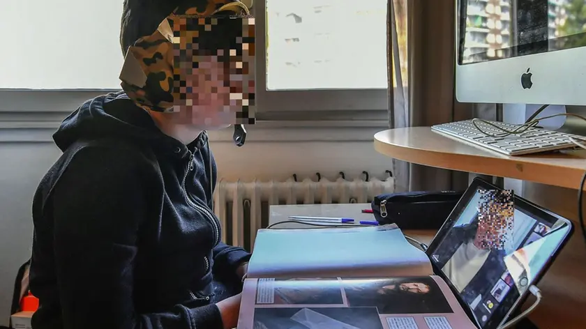Martin, a Milanese middle school student performs lessons in DAD (Distance Learning) after entering the Lombardy Region in the reinforced orange zone, in Milan, Italy, March 05, 2021. ANSA / Andrea Fasani