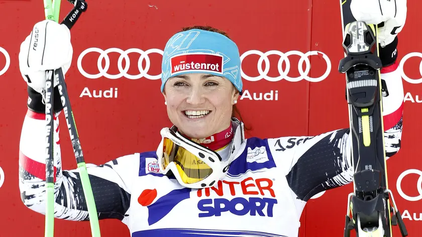 Winner Elisabeth Goergl of Austria celebrates on the podium after the Alpine Ski World Cup SuperG race in Cortina d'Ampezzo, Italy, 23 January 2014. ANSA/ANDREA SOLERO