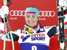 Winner Elisabeth Goergl of Austria celebrates on the podium after the Alpine Ski World Cup SuperG race in Cortina d'Ampezzo, Italy, 23 January 2014. ANSA/ANDREA SOLERO