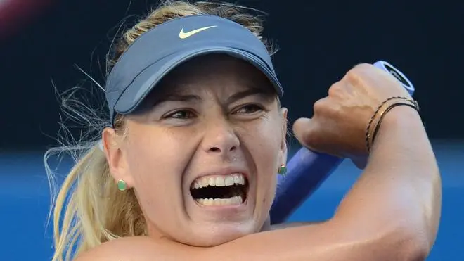 epa03538300 Maria Sharapova of Russia in action during her match against Misaki Doi of Japan, in round two of the Australian Open tennis tournament in Melbourne, Australia, 16 January 2013. EPA/JULIAN SMITH AUSTRALIA AND NEW ZEALAND OUT