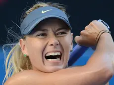 epa03538300 Maria Sharapova of Russia in action during her match against Misaki Doi of Japan, in round two of the Australian Open tennis tournament in Melbourne, Australia, 16 January 2013. EPA/JULIAN SMITH AUSTRALIA AND NEW ZEALAND OUT