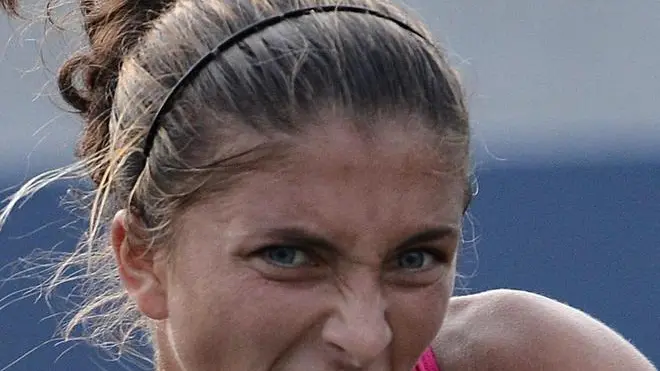 epa03379578 Sara Errani of Italy hits a return to Olga Puchkova of Russia during their match on the sixth day of the 2012 US Open Tennis Championship at the USTA National Tennis Center in Flushing Meadows, New York, USA, 01 September 2012. The US Open runs through Sunday 09 September 2012. EPA/JUSTIN LANE
