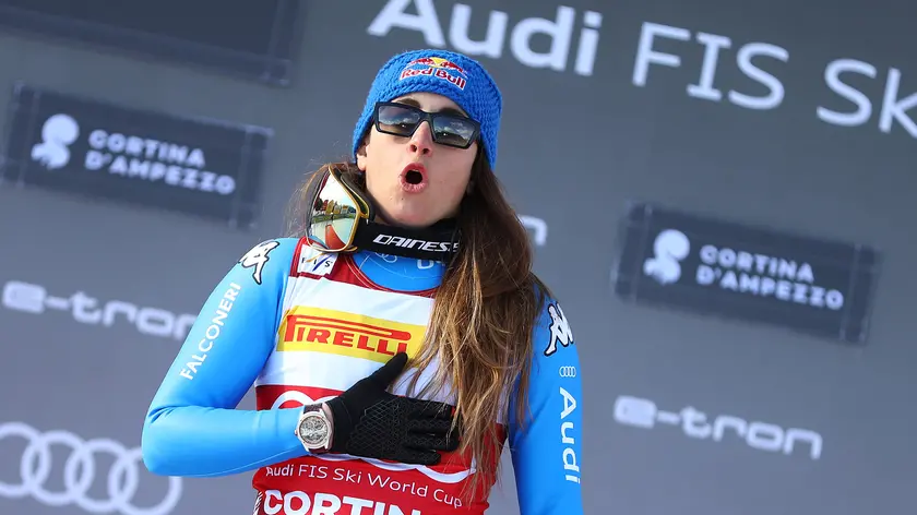 Winner Sofia Goggia of Italy celebrates on the podium after the Women's Downhill race at the FIS Alpine Skiing World Cup in Cortina d'Ampezzo, Italy, 22 January 2022. ANSA/ANDREA SOLERO