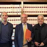 A sinistra Niccolò Fochesato, presidente della Fondazione San Giovanni Paolo II; al centro il notaio; a destra, monsignor Giorgio Lise