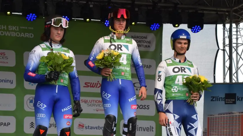 Michael Bertagno (al centro) il giorno dell'oro Mondiale
