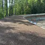 I lavori di mascheramento alla pista da bob per le olimpiadi invernali