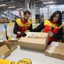 Due addetti dell’hub logistico della Dhl a Casier (Treviso)