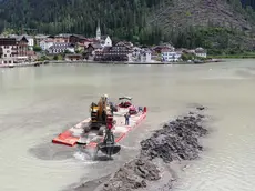 Lavori di sghiaiamento ad Alleghe