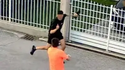 Un frame che riprende l’aggressore (in nero) e il soccorritore