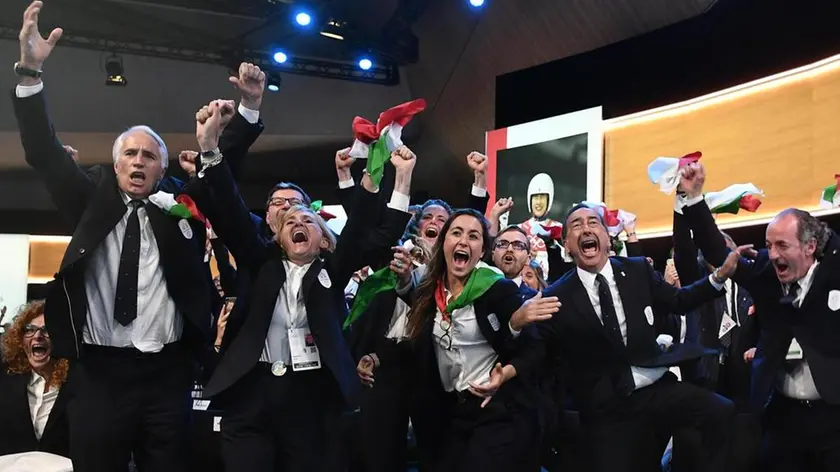 epa07670944 Italy's National Olympic Committee (CONI) president Giovanni Malago (L) and members of Milan-Cortina 2026 Winter Olympic Games bid delegation celebrate after winning the bid to host the 2026 Winter Olympic Games during the first day of the 134th Session of the International Olympic Committee (IOC), at the SwissTech Convention Centre, in Lausanne, Switzerland, 24 June 2019. EPA/PHILIPPE LOPEZ / POOL