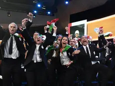 epa07670944 Italy's National Olympic Committee (CONI) president Giovanni Malago (L) and members of Milan-Cortina 2026 Winter Olympic Games bid delegation celebrate after winning the bid to host the 2026 Winter Olympic Games during the first day of the 134th Session of the International Olympic Committee (IOC), at the SwissTech Convention Centre, in Lausanne, Switzerland, 24 June 2019. EPA/PHILIPPE LOPEZ / POOL