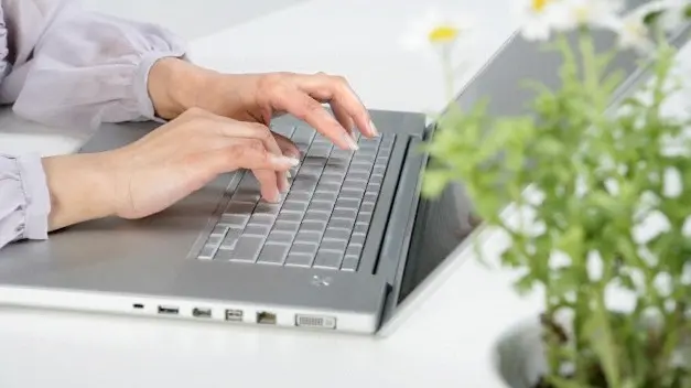 Beijing, China --- Person Typing On Laptop --- Image by © Blue Jean Images/Corbis