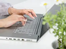 Beijing, China --- Person Typing On Laptop --- Image by © Blue Jean Images/Corbis