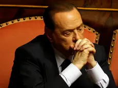 In this photo taken on Friday, July 19, 2013 Silvio Berlusconi attends a voting session at the Senate in Rome. Silvio Berlusconi, the billionaire media baron and former premier, sometimes quipped that he was running out of money after two decade of steadily paying millions of euros (dollars) to a stable of Italy's leading lawyers to defend him in a raft of criminal cases. The legal team earned its keep, either eventually scoring acquittals or devising strategies that helped stretch out the court calendar for so long the cases died when statutes of limitations ran out. But this time, they failed to deliver him from final judgment day for a guilty verdict that arrives Tuesday at Italy's highest court, and Berlusconi's no longer joking. (AP Photo/Gregorio Borgia)