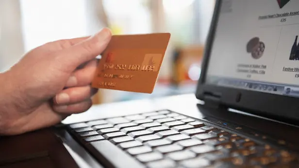 Man Shopping on Internet --- Image by © moodboard/Corbis