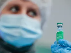 epa09077985 A Ukrainian medical worker shows the AstraZeneca (Covishield) vaccine in Kiev, Ukraine, 16 March 2021 during public vaccination of medical workers and religious figures. In total, 53,155 people have received their first doze of the vaccine since the launch of a nationwide COVID-19 vaccination campaign on 24 February 2021. Ukraine has signed a contract for the supply of 12 million doses of COVID-19 vaccines, which were developed by AstraZeneca (UK-Sweden) and NovaVax (USA) and are produced at the Serum Institute facilities (India). EPA/SERGEY DOLZHENKO