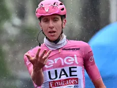 Slovenian rider Tadej Pogacar of Uae Team Emirates celebrates after crossing the finish line and win the 16th stage of the 107 Giro d'Italia 2024, cycling race over 202 km from Livigno to Santa Cristina Valgardena, Italy, 21 May 2024. ANSA/LUCA ZENNARO