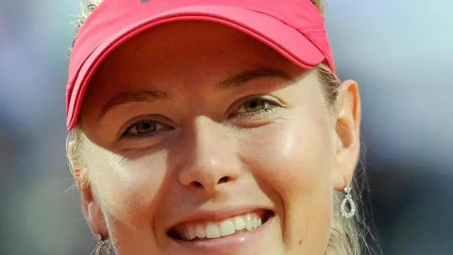 Russian tennis player Maria Sharapova poses with the winner's trophy after beating Chinese tennis player Na li in their final match of the Italian Open tennis tournament in the Central Stadium at the Foro Italico in Rome, Italy, 20 May 2012. Sharapova won 4-6, 6-4 and 7-6. ANSA/ETTORE FERRARI