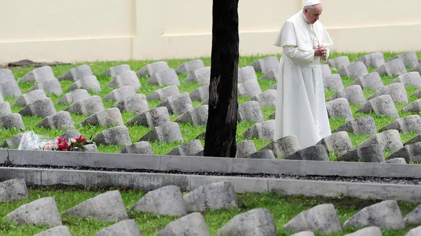 Pope Francis visits the Austro-Hungarian cemetery in Fogliano to pray and pay a tribute to the fallen on the battlefield during the First World War before celebrating a solemn mass at the war memorial at Redipuglia to mark the 100th anniversary of the start of the First World War, 13 September 2014. ANSA/DANIEL DAL ZENNARO