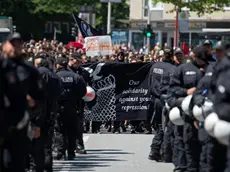 epa06077961 Protesters walk through the streets Harburg district during a demonstration called 'No one forgotten - nothing forgiven' after the G20 summit in Hamburg, Germany, 09 July 2017. The G20 Summit (or G-20 or Group of Twenty) is an international forum for governments from 20 major economies. The summit was taking place in Hamburg from 07 to 08 July 2017. EPA/DANIEL KOPATSCH