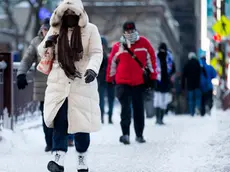 Commuters depart from Union Station with wind chills nearing minus 30 Fahrenheit on Tuesday, Jan. 7, 2014, in downtown Chicago. Dangerously cold polar air snapped decades-old records as it spread Tuesday from the Midwest to southern and eastern parts of the U.S. and eastern Canada, making it hazardous to venture outside and keeping many schools and businesses closed. (AP Photo/Andrew A. Nelles)