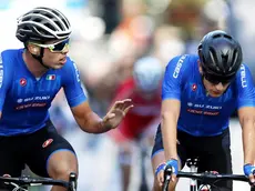 epa06221375 Second placed Italian rider Luca Rastelli (R) and his third placed compatriot Michele Gazzoli react after crossing the finish line during the UCI Cycling Road World Championships Men Junior Race in Bergen, Norway, 23 September 2017. EPA/CORNELIUS POPPE NORWAY OUT