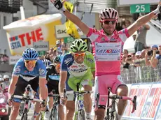 Joaquin Rodriguez (Katusha, ESP) wins in Cortina d'Ampezzo (northern Italy) the 17th stage of Giro d'Italia, Falzes-Cortina, followed by italian Ivan Basso (Liquigas) and canadian Ryder Hesjedal (Garmin-Barracuda), 23 may 2012. ANSA/ SABINE JACOB