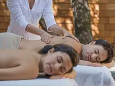 Couple receiving massage in spa --- Image by © Hiya Images/Corbis