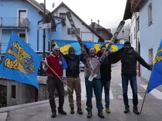 Local citizens with flags of arms of the Friuli Venezia Giulia Region celebrate after the decision of the Italian Lower House that approved the law proposal for moving the Veneto region border town of Sappada juridically to the neighbouring Friuli Venezia Giulia region in Sappada, northern Italy, 22 November 2017. Friuli Venezia Giulia region is one of five Italian regions with special status with more autonomy from the general government..ANSA/FRANCESCO FONTANA HOFFER