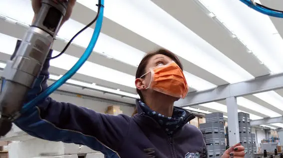 A worker of the Polini company at work wearing a protective mask, Alzano Lombardo, Bergamo, 06 March 2020. The factory is located in Alzano Lombardo one of the villages in the province of Bergamo which risks becoming "red zone" due to the spread of Coronavirus.. According to official figures the number of Coronavirus cases in Italy, the center of Europe's COVID-19 outbreak, was at 3,858 cases by 06 March with a death toll of 148 people while 414 people have recovered since the outbreak. ANSA/MATTEO BAZZI